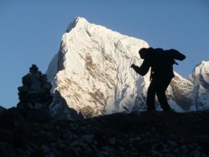 Monte & a chorten as silhouettes on Cholatse Peak