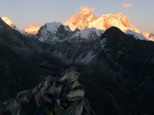 Everest, center, from Gokyo Ri . . . high winds and steep slopes combine to keep Everest relatively snow-free
